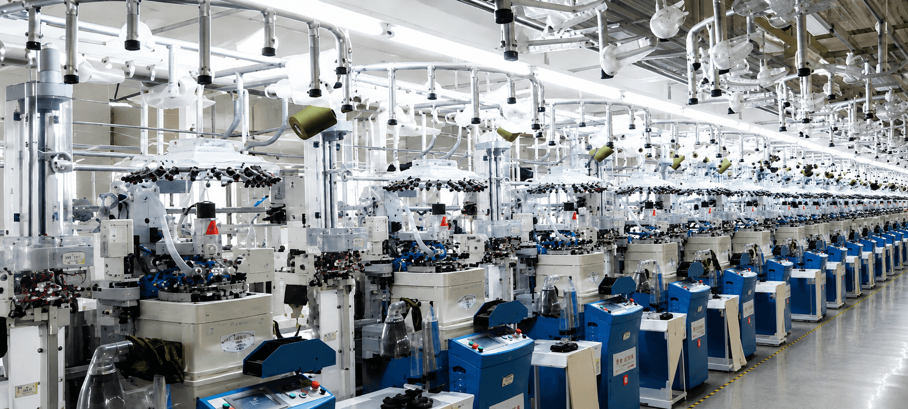 Rows of sock knitting machines at a manufacturing partner