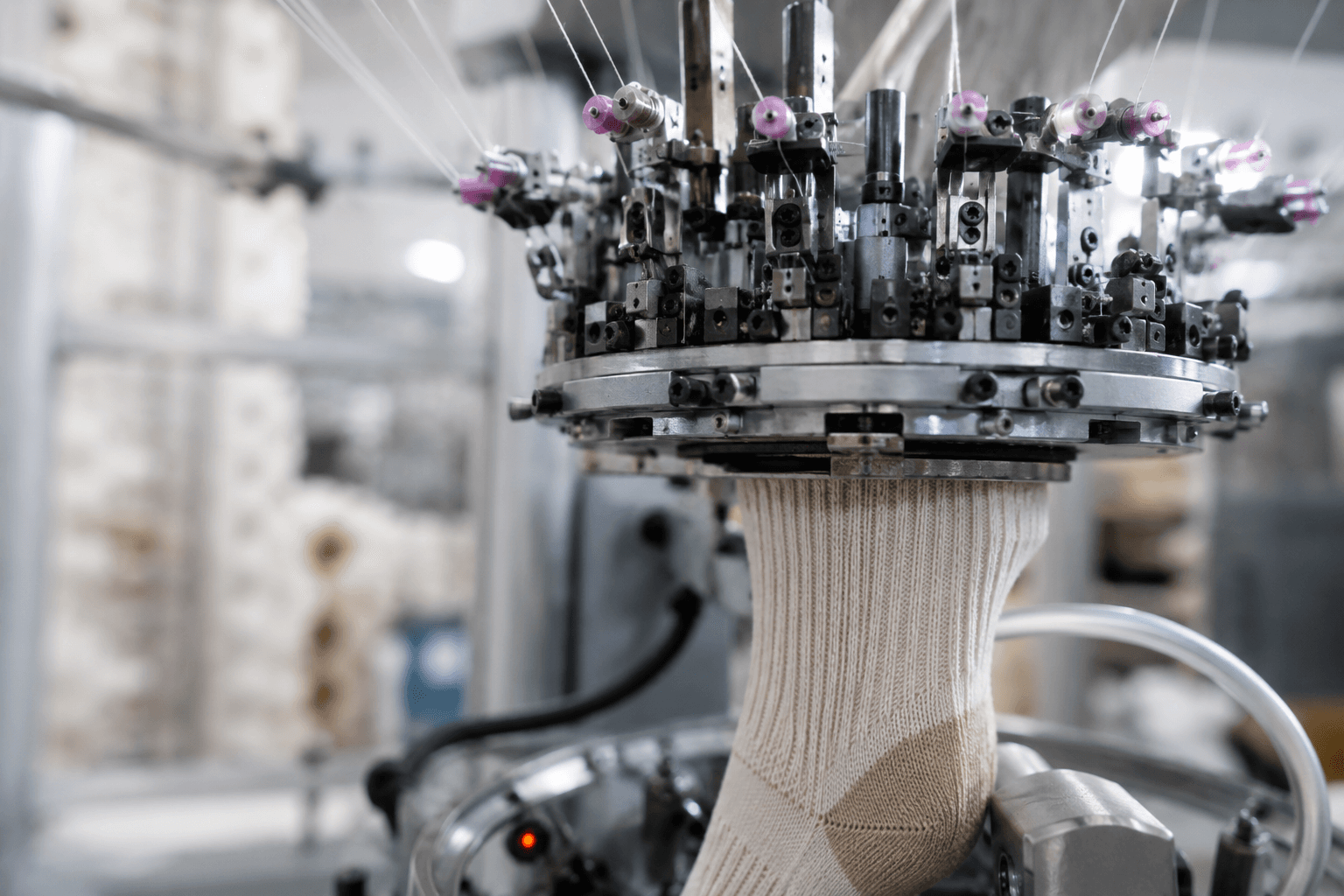 Sock knitting machine during production preparation